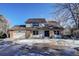 Two-story home with brick and siding, attached garage, and landscaping at 3080 E Geddes Pl, Centennial, CO 80122