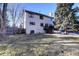 Back of house with deck and large backyard at 3080 E Geddes Pl, Centennial, CO 80122