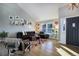 Bright living room with vaulted ceiling, comfy sectional sofa, and hardwood floors at 3080 E Geddes Pl, Centennial, CO 80122