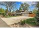 Well-maintained two-story home with a spacious driveway and manicured front lawn at 11305 W 78Th Dr, Arvada, CO 80005