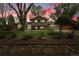 Charming two-story home featuring mature landscaping and a well-manicured front yard at 11305 W 78Th Dr, Arvada, CO 80005