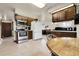 Bright kitchen view, showcasing stainless steel appliances, wood cabinets, and open concept design at 11305 W 78Th Dr, Arvada, CO 80005