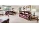 Bright living room featuring comfortable sofas, side tables, and ample natural light at 11305 W 78Th Dr, Arvada, CO 80005