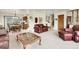 Open-concept living area with dining space, comfortable furniture, and natural light at 11305 W 78Th Dr, Arvada, CO 80005