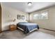 Bedroom with carpet flooring, window view, and neutral-toned walls at 11305 W 78Th Dr, Arvada, CO 80005