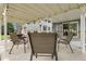 Outdoor patio with seating, string lights, and view into home, perfect for outdoor relaxation at 11305 W 78Th Dr, Arvada, CO 80005