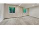 Finished basement area with neutral carpet and bright windows. Great potential! at 2171 E 99Th Pl, Thornton, CO 80229