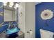 Stylish powder room with vessel sink, unique wall decor, and modern fixtures at 2171 E 99Th Pl, Thornton, CO 80229