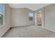 Spacious bedroom with vaulted ceiling, new carpet, and ensuite bathroom entrance at 2171 E 99Th Pl, Thornton, CO 80229