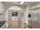 Open dining room with chandelier and sliding door access to the rear deck at 2171 E 99Th Pl, Thornton, CO 80229