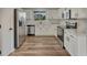 Modern kitchen featuring stainless steel appliances, white cabinets, and durable countertops at 2171 E 99Th Pl, Thornton, CO 80229
