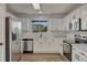 Updated kitchen featuring stainless steel appliances, white cabinets, and light countertops at 2171 E 99Th Pl, Thornton, CO 80229