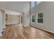 Inviting living area with large windows and wood flooring, offering serene views and a spacious feel at 2171 E 99Th Pl, Thornton, CO 80229
