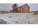 Charming barn-style community building with large windows and a rustic feel at 17265 E 110Th Ct, Commerce City, CO 80022