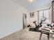 Neutral bedroom featuring an exercise bike and a full length mirror at 17265 E 110Th Ct, Commerce City, CO 80022