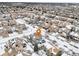 Aerial view of a two-story house in a snow-covered neighborhood at 5008 S Nepal St, Centennial, CO 80015