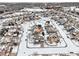 Aerial view of a two-story house in a snow-covered neighborhood at 5008 S Nepal St, Centennial, CO 80015