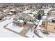 Two-story house in a snow-covered neighborhood, aerial view at 5008 S Nepal St, Centennial, CO 80015