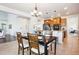 Kitchen dining area features a chandelier and hardwood floors at 5008 S Nepal St, Centennial, CO 80015