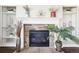 Stone fireplace with built-in shelving on either side at 5008 S Nepal St, Centennial, CO 80015