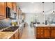 Open kitchen with gas range and granite countertops at 5008 S Nepal St, Centennial, CO 80015