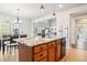 Kitchen island with granite countertop and sink at 5008 S Nepal St, Centennial, CO 80015