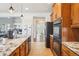 Large kitchen with granite counters and stainless steel appliances at 5008 S Nepal St, Centennial, CO 80015