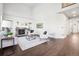 Living room with hardwood floors, fireplace, and high ceilings at 5008 S Nepal St, Centennial, CO 80015