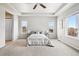 Main bedroom with ceiling fan and large windows at 5008 S Nepal St, Centennial, CO 80015