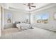 Main bedroom with ceiling fan and large windows at 5008 S Nepal St, Centennial, CO 80015