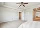 Main bedroom with ceiling fan and ensuite bath at 5008 S Nepal St, Centennial, CO 80015