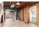 Unfinished basement with exposed ceiling, concrete walls and floors, and unfinished framing at 1410 S Grant St, Longmont, CO 80501