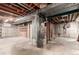 Unfinished basement with exposed pipes, and ceiling, and an installed furnace for heating the home at 1410 S Grant St, Longmont, CO 80501