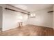 Spacious bedroom featuring hardwood floors, large window, and decorative shelving for storage at 1410 S Grant St, Longmont, CO 80501