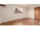 Bright bedroom featuring a large window providing plenty of natural light and hardwood floors at 1410 S Grant St, Longmont, CO 80501