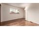 Bedroom featuring hardwood floors and a large window, perfect for relaxing and enjoying the view at 1410 S Grant St, Longmont, CO 80501