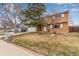 Inviting two-story home with a well-maintained lawn, garage and mature trees at 1410 S Grant St, Longmont, CO 80501