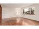 Elegant living room with hardwood floors, large windows, and plenty of natural light at 1410 S Grant St, Longmont, CO 80501