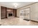 Living room with fireplace, built-in shelving, and sliding glass doors leading to the outside at 1410 S Grant St, Longmont, CO 80501