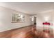 Bright living room featuring beautiful hardwood floors and large windows at 1410 S Grant St, Longmont, CO 80501