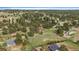 Picturesque aerial view showcasing a home, multiple outbuildings, a lush yard, and mature evergreens at 3337 Ponderosa Rd, Franktown, CO 80116