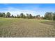 A sprawling green lawn leads to this charming home with a red roof, perfect for outdoor enjoyment at 3337 Ponderosa Rd, Franktown, CO 80116