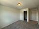 Cozy bedroom with a closet and soft carpet; creating a comfortable retreat at 9041 Redfield Ln, Parker, CO 80134