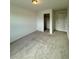 Carpeted bedroom with a closet and neutral walls, ready for personalization at 9041 Redfield Ln, Parker, CO 80134