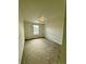 Empty bedroom featuring neutral walls, plush carpet, and window providing ample natural light at 9041 Redfield Ln, Parker, CO 80134