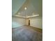 Large bedroom featuring neutral carpet, recessed lighting, and a tray ceiling detail at 9041 Redfield Ln, Parker, CO 80134
