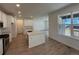 Spacious kitchen with stainless appliances, a center island, and hardwood floors at 9041 Redfield Ln, Parker, CO 80134