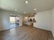 Open-concept living space with modern floors and sliding door to outdoor deck at 9041 Redfield Ln, Parker, CO 80134