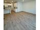 Open-concept living space with wood floors, a modern kitchen, and recessed lighting at 9041 Redfield Ln, Parker, CO 80134