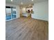 Bright, open living area connected to a modern kitchen with sliding doors to the outdoor deck at 9041 Redfield Ln, Parker, CO 80134